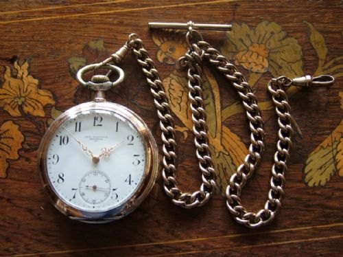fig 1. Antique galonne cased Omega pocket watch and chain