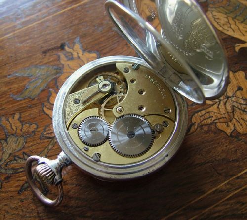 fig 2. An antique galonne cased Omega pocket watch