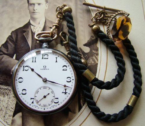 fig 1. 1920s Omega gun metal pocket watch with albert