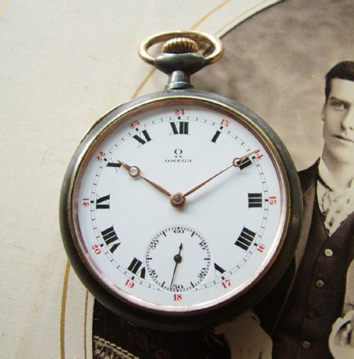 A 1920s Omega Gun Metal Cased Pocket Watch