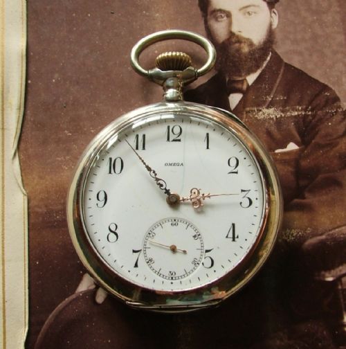 fig 1. An antique silver Omega pocket watch