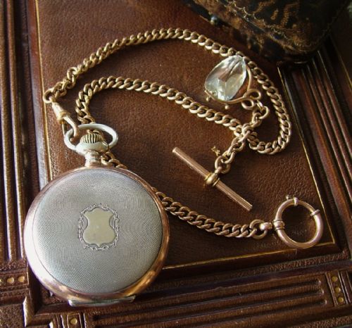 fig 3. An antique Zenith pocket watch, chain and box