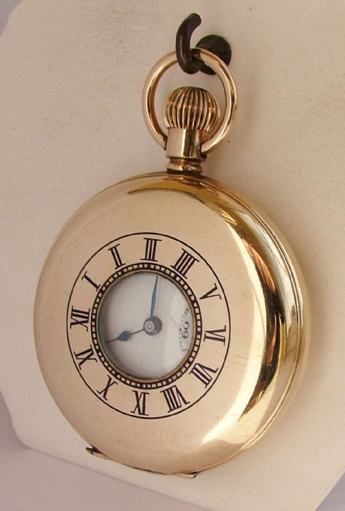 A 1920s Record Half Hunter Pocket Watch.