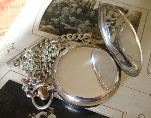 fig 1. An antique silver pocket watch and chain, Hackney