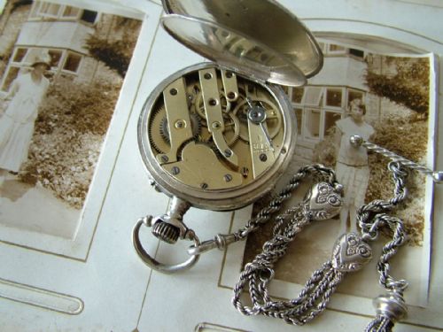 fig 2. An antique open faced pocket watch and albertina