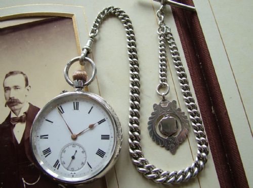 fig 1. Antique silver Longines pocket watch with chain