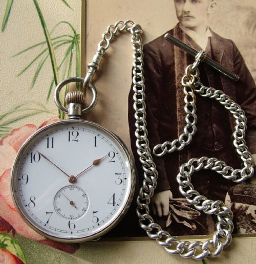 fig 1. Antique silver Omega pocket watch and chain