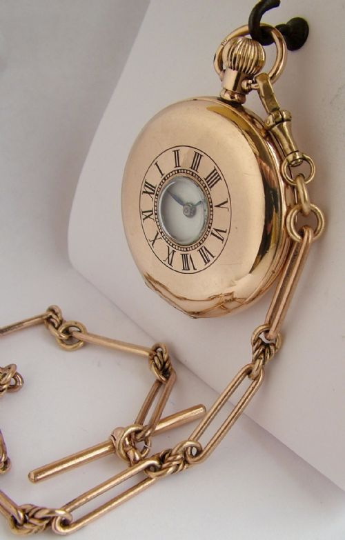 fig 1. 1920s Cyma half hunter pocket watch and chain
