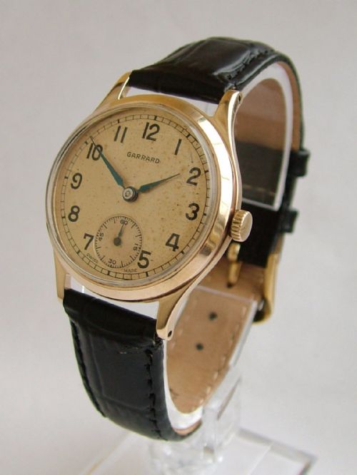 A Gents 9 Carat Gold Garrard Wrist Watch, 1957