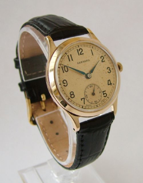 fig 1. A gents 9 carat gold Garrard wrist watch, 1957