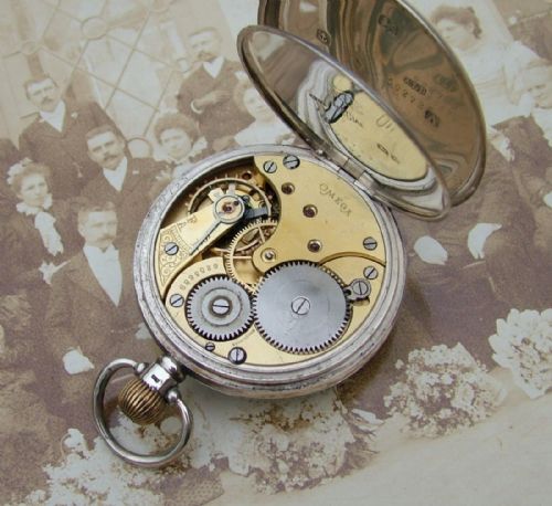 fig 1. A 1920s silver Omega pocket watch