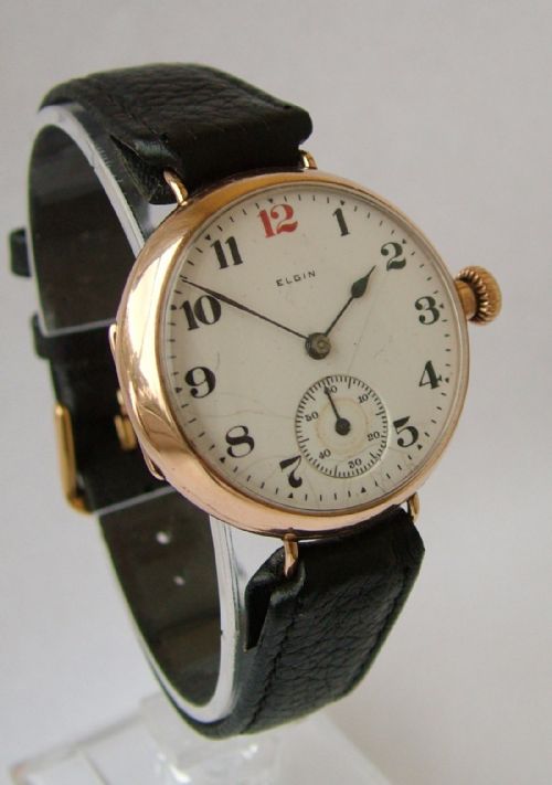 fig 1. A gents 9ct gold Elgin gents wrist watch, 1920