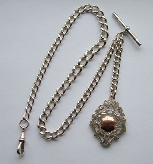 An Antique Silver Pocket Watch Chain and Fob