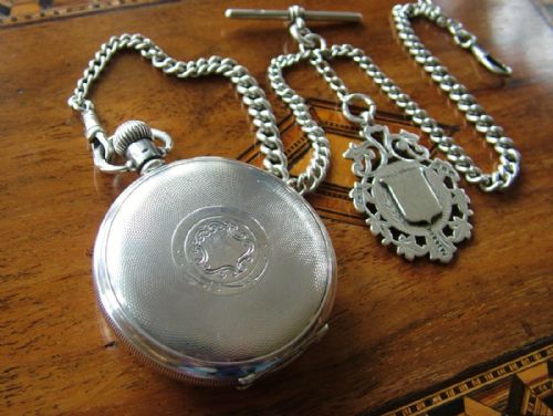 fig 1. Silver pocket watch and chain, Harris Stone, Leeds