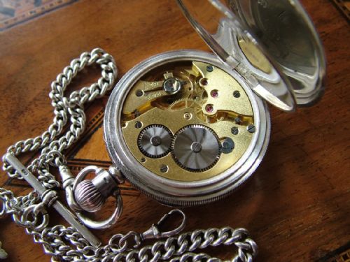 fig 2. Silver pocket watch and chain, Harris Stone, Leeds