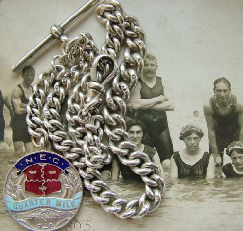An Antique Single Watch Chain with Swimming Fob