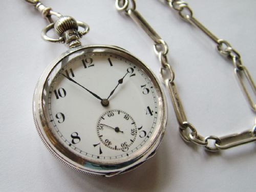 A Swiss Open Faced Silver Pocket Watch with Chain