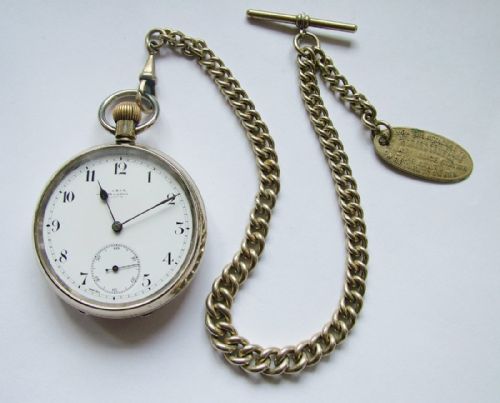 fig 1. An antique Omega pocket watch with chain