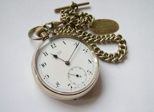 fig 2. An antique Omega pocket watch with chain