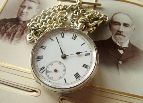 fig 1. An antique silver pocket watch with chain