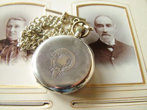 fig 2. An antique silver pocket watch with chain