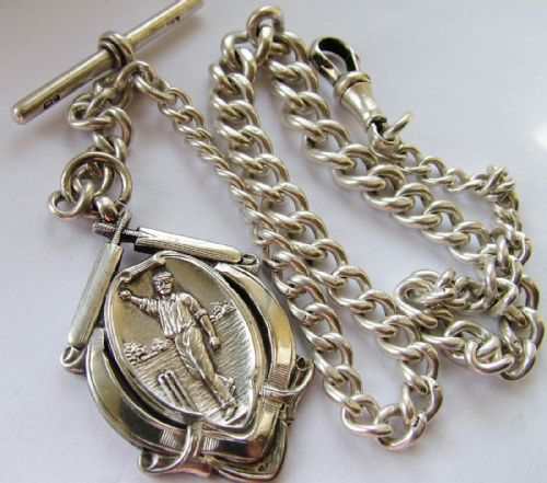 fig 1. Antique silver chain with a fantastic cricket fob
