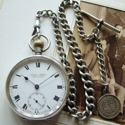 An Antique Silver Pocket Watch with Silver Chain