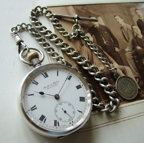 fig 1. An antique silver pocket watch with silver chain