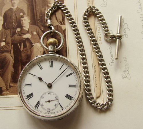 fig 1. Antique silver open faced pocket watch and chain