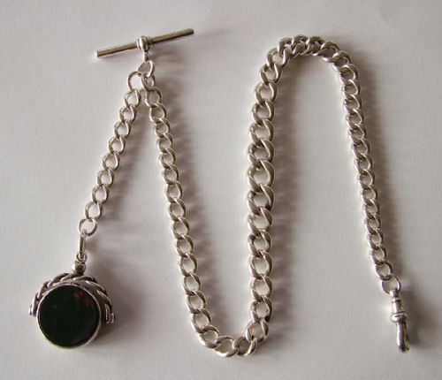 An Antique Silver Pocket Watch Chain and Swivel Fob.