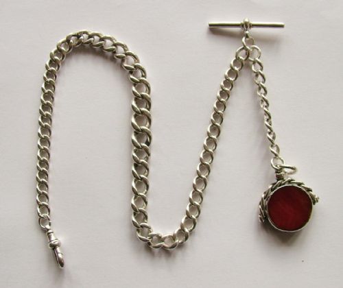fig 1. An antique silver pocket watch chain and swivel fob.