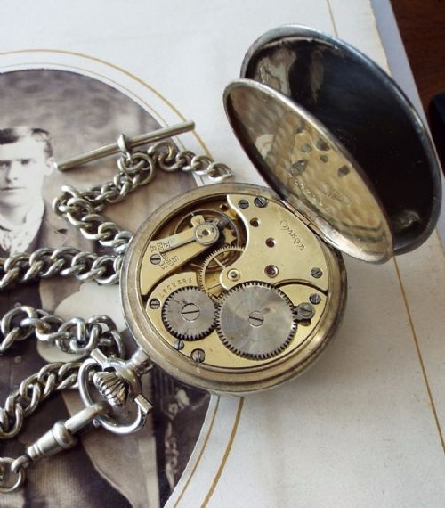 fig 1. A 1920s Omega pocket watch with chain