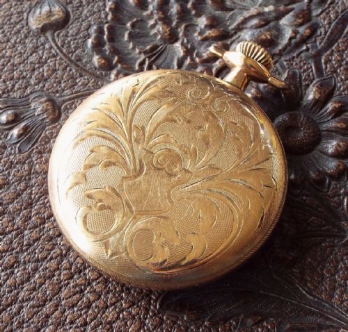fig 1. An ornate antique open faced Pioneer pocket watch
