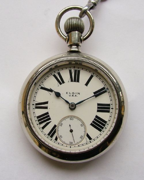 fig 1. A large 1920s Elgin pocket watch, chain & vesta