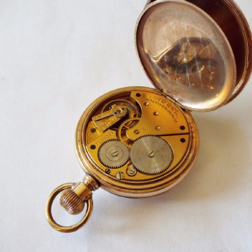 fig 1. An antique Waltham open faced pocket watch