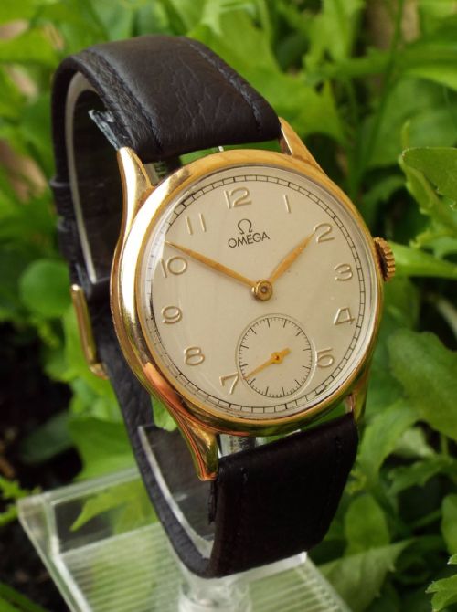 fig 1. A gents 1940s 9ct gold Omega wrist watch