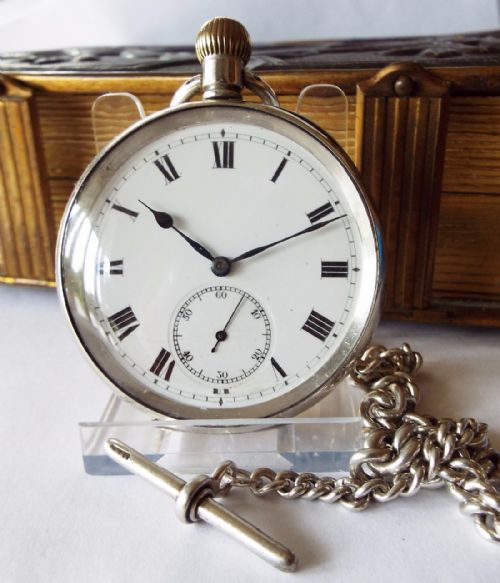 An Antique Silver Pocket Watch with Silver Albert
