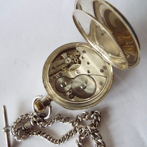 fig 1. An antique silver pocket watch with silver albert