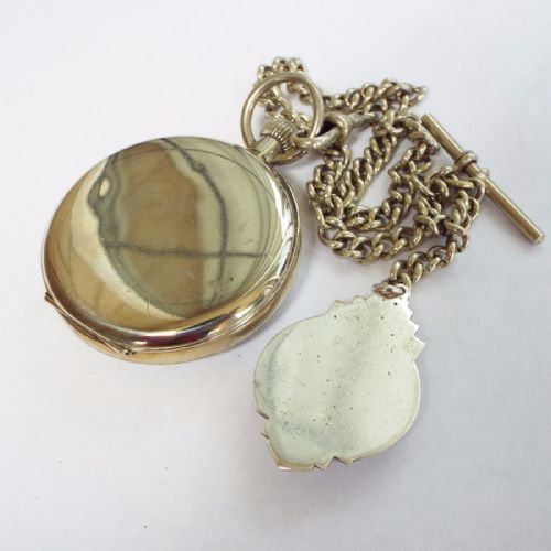 fig 1. A 1930s pocket watch, chain and football albert