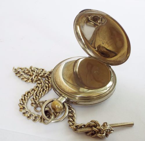 fig 2. An antique Omega pocket watch with chain
