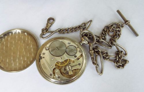 fig 1. Vintage Swiss open faced pocket watch with albert