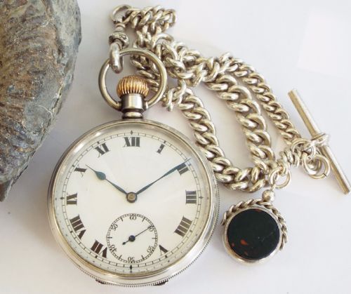 fig 1. 1938 silver pocket watch with silver chain
