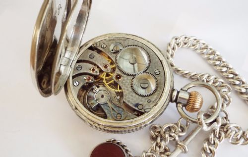 fig 3. 1938 silver pocket watch with silver chain