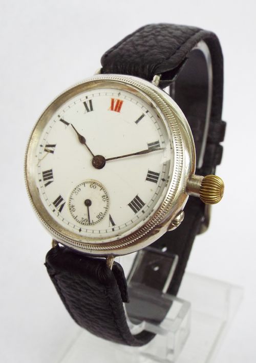 fig 1. Antique silver trench watch with Ormsby crest