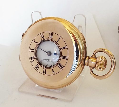 A 1920s Swiss Half Hunter Pocket Watch.