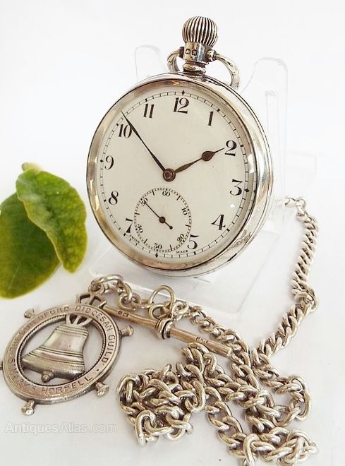 A Silver 1930s Swiss Pocket Watch and Chain.