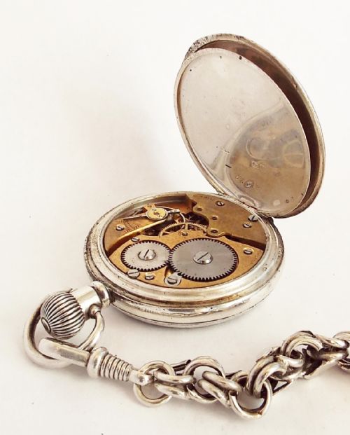 fig 2. 1919 silver pocket watch and chain.