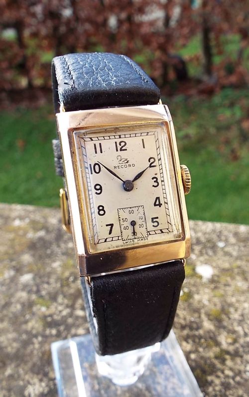 A 1940s Gents 9 Carat Gold Record Wrist Watch.