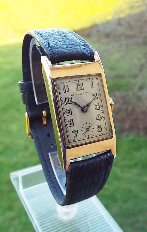 A 1940s Gents 9 Carat Gold Art Deco Wrist Watch.