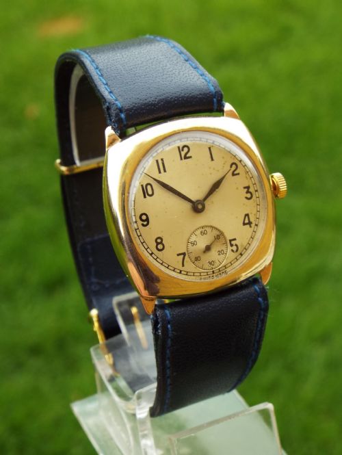 fig 1. Gents 9ct gold cushion cased wrist watch, 1940s